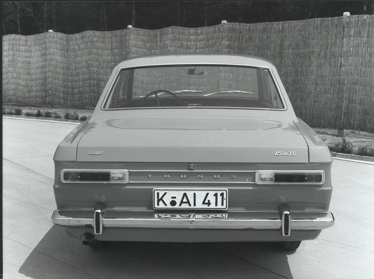 This archival image documents the 1968 Ford Taunus 15M P6 TS rear view with scenic fence and is preserved in the Ford Heritage Vault as part of Ford Motor Company's historic photographic archive. Free for personal, non-commercial use. Ford Heritag...