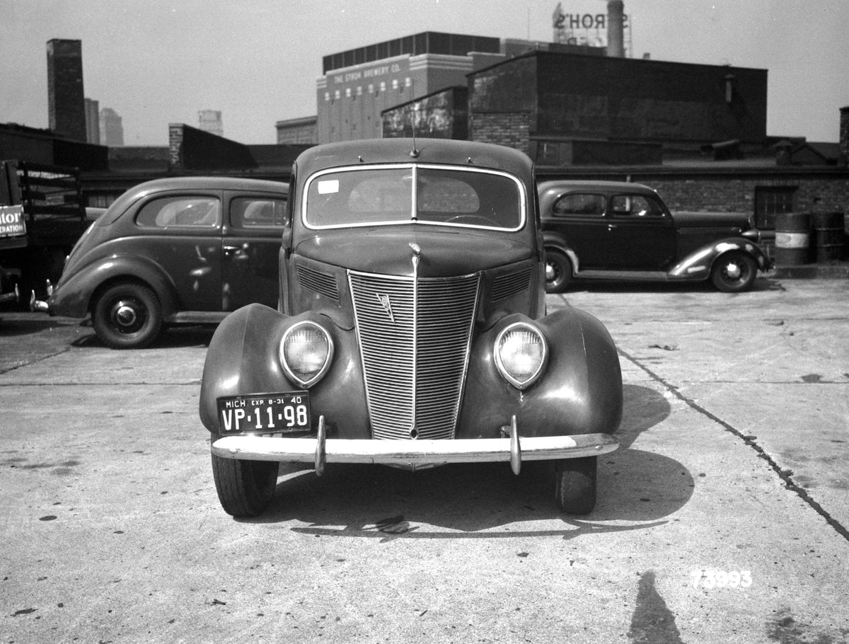 This archival image documents the 1937 Ford Club Coupe and is preserved in the Ford Heritage Vault as part of Ford Motor Company's historic photographic archive. Free for personal, non-commercial use. Ford Heritage Vault reference AR-2008-8.1.6.156.