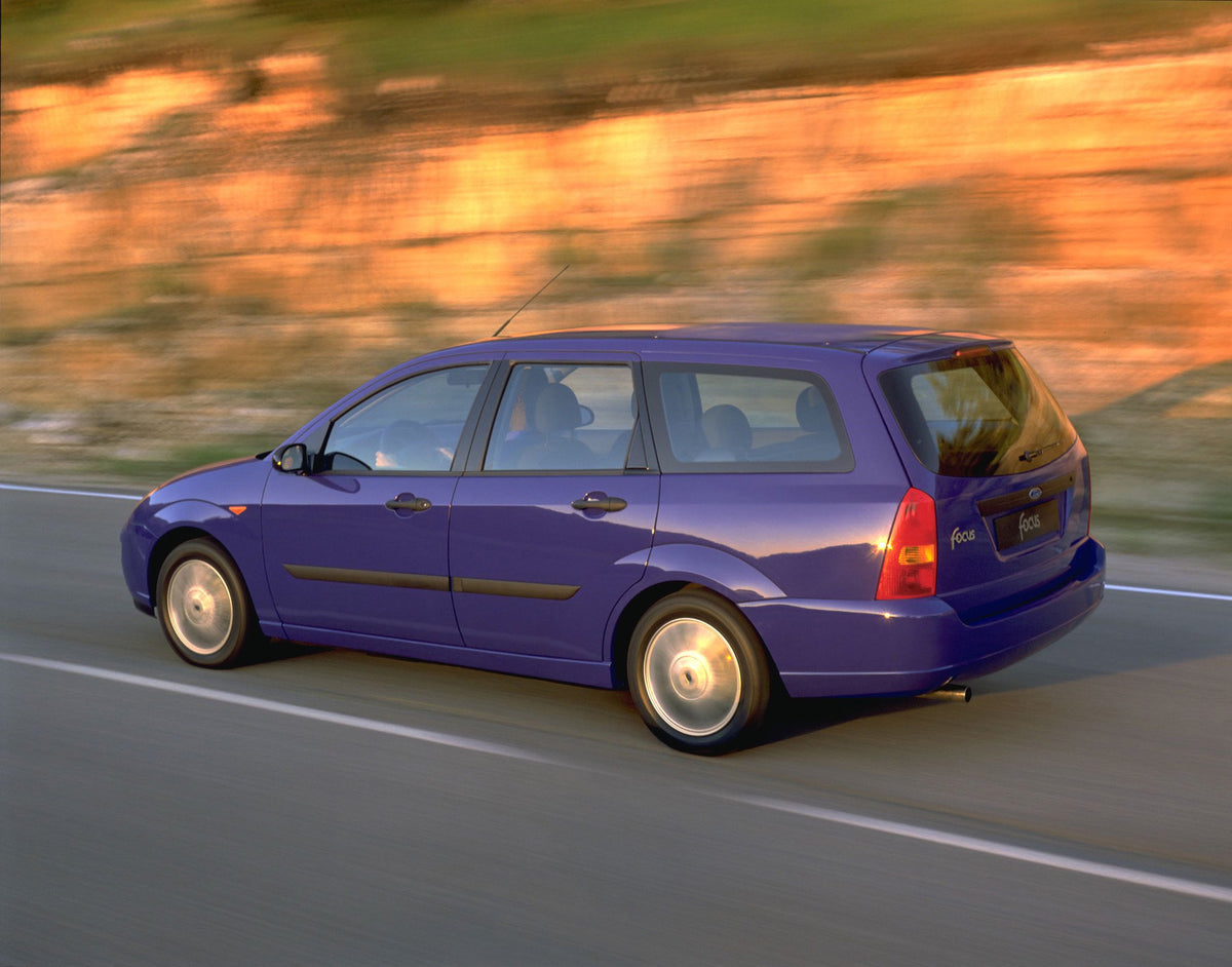 This archival image documents the 1998 Ford Focus rear view action shot on scenic road and is preserved in the Ford Heritage Vault as part of Ford Motor Company's historic photographic archive. Free for personal, non-commercial use. Ford Heritage ...