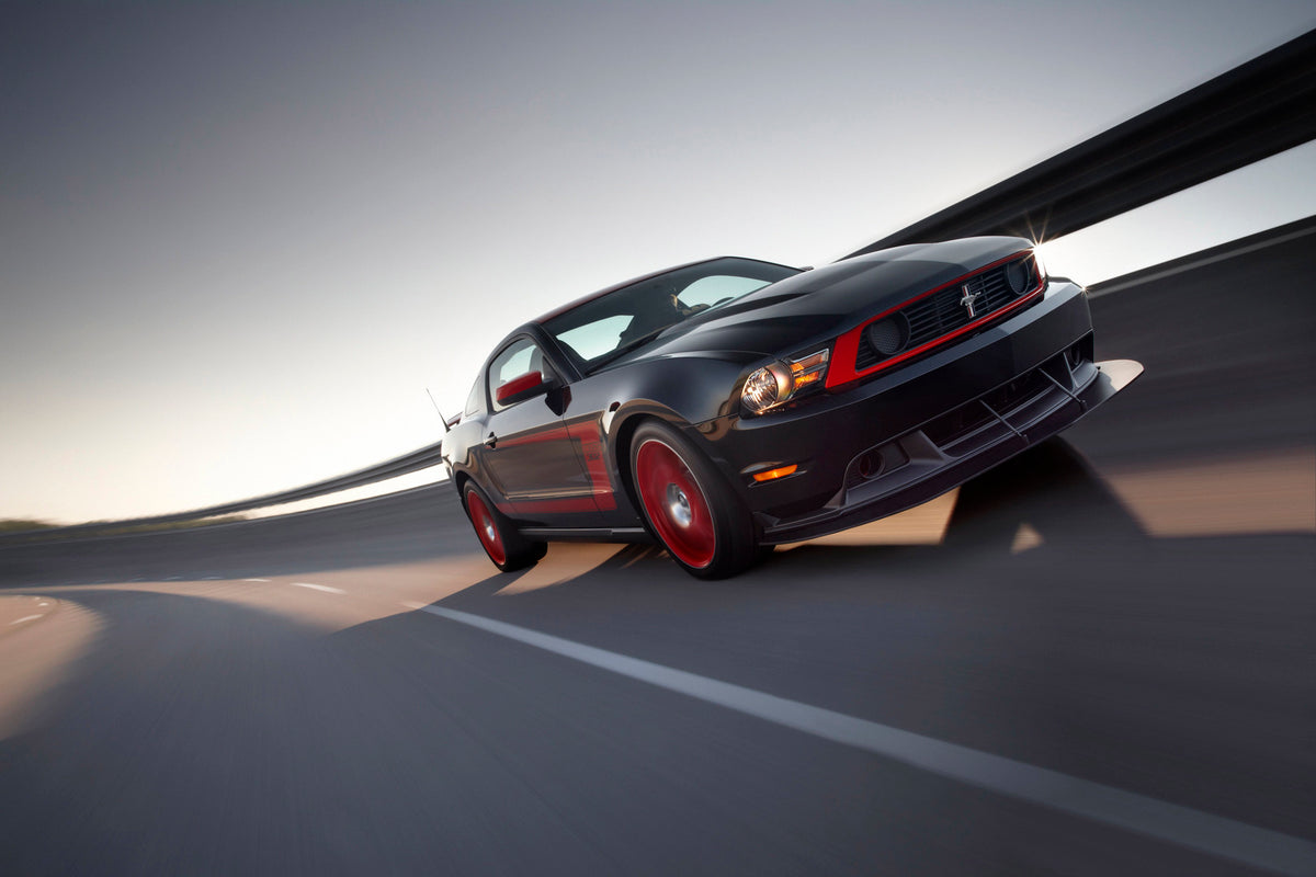 This archival image documents the 2012 Ford Mustang Boss 302 and is preserved in the Ford Heritage Vault as part of Ford Motor Company's historic photographic archive. Free for personal, non-commercial use. Ford Heritage Vault reference AR-2008-8....