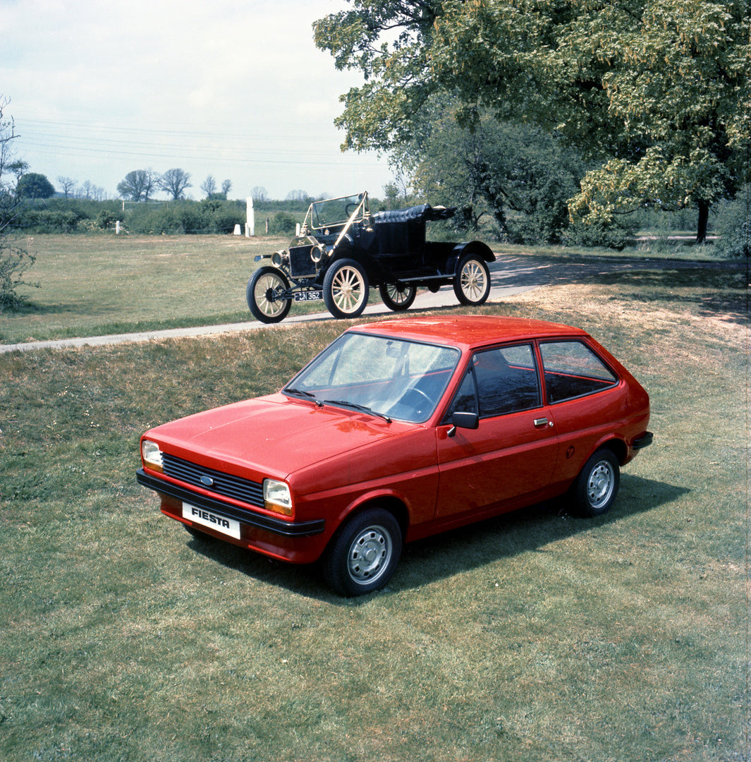 This archival image documents the 1976 Ford Fiesta Mark I with Model T in scenic park and is preserved in the Ford Heritage Vault as part of Ford Motor Company's historic photographic archive. Free for personal, non-commercial use. Ford Heritage V...