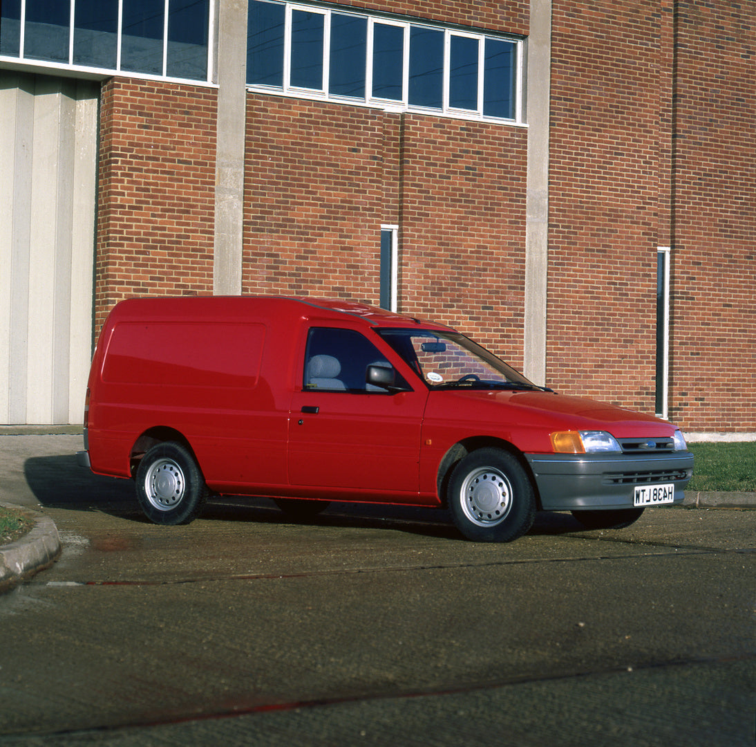 This archival image documents the 1991 Ford Escort Mark V Van in front of brick building and is preserved in the Ford Heritage Vault as part of Ford Motor Company's historic photographic archive. Free for personal, non-commercial use. Ford Heritag...