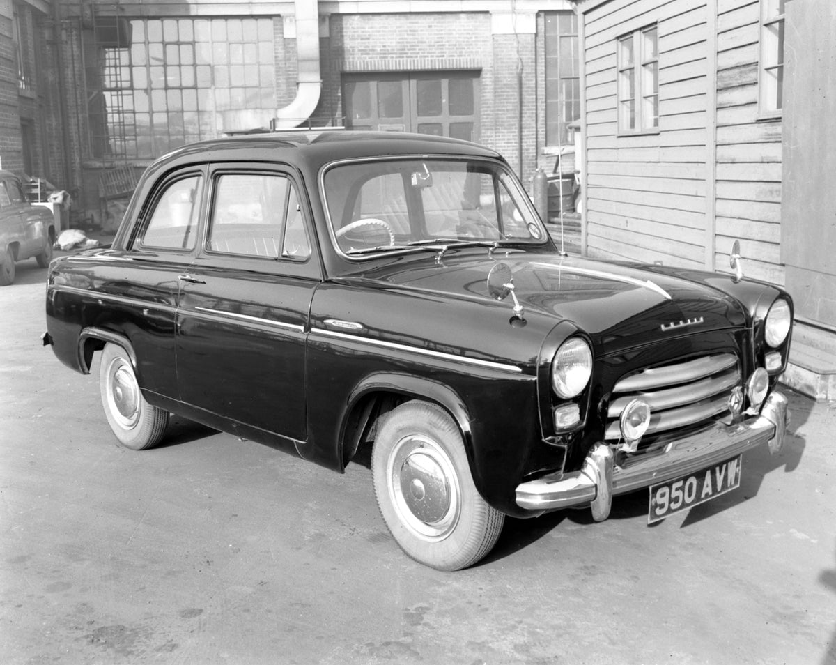 This archival image documents the 1954 Ford Anglia with chrome strip and is preserved in the Ford Heritage Vault as part of Ford Motor Company's historic photographic archive. Free for personal, non-commercial use. Ford Heritage Vault reference AR...
