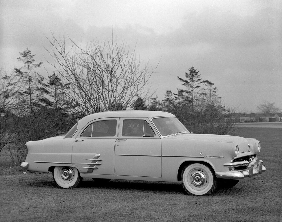 This archival image documents the 1953 Meteor Customline Sedan with scenic trees AR-2007-5 and is preserved in the Ford Heritage Vault as part of Ford Motor Company's historic photographic archive. Free for personal, non-commercial use. Ford Herit...