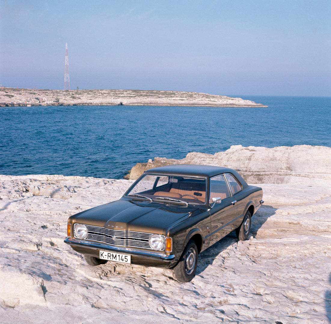 This archival image documents the 1970 Ford Taunus L on scenic rocky beach and is preserved in the Ford Heritage Vault as part of Ford Motor Company's historic photographic archive. Free for personal, non-commercial use. Ford Heritage Vault refere...