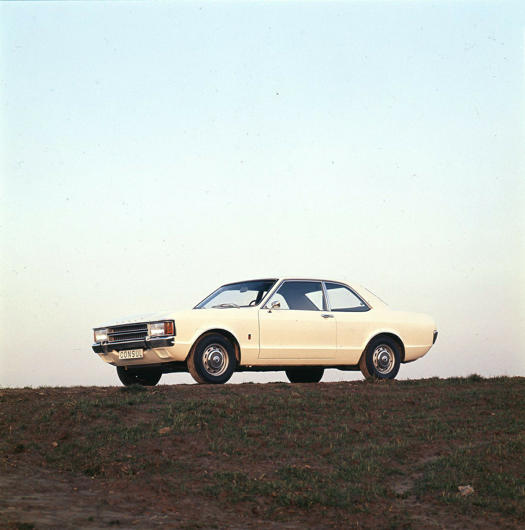 This archival image documents the 1973 Ford Consul on scenic hill and is preserved in the Ford Heritage Vault as part of Ford Motor Company's historic photographic archive. Free for personal, non-commercial use. Ford Heritage Vault reference AR-20...