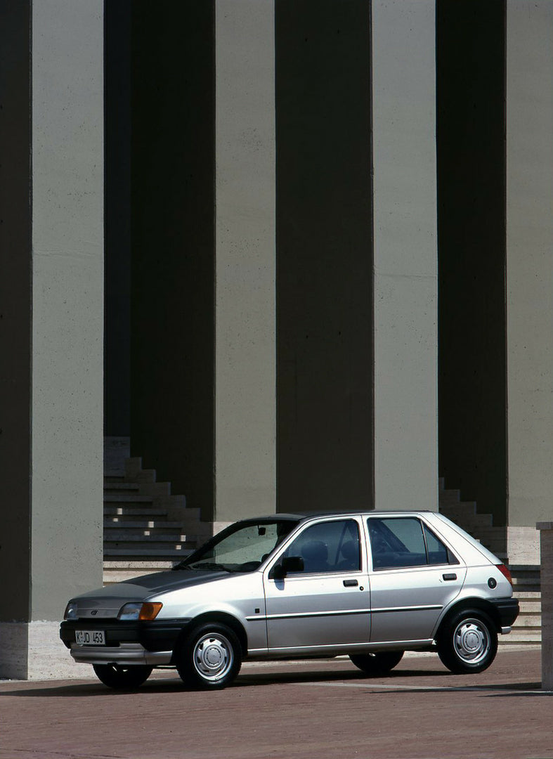 This archival image documents the 1988 Ford Fiesta Mark III LHD in front of scenic building and is preserved in the Ford Heritage Vault as part of Ford Motor Company's historic photographic archive. Free for personal, non-commercial use. Ford Heri...