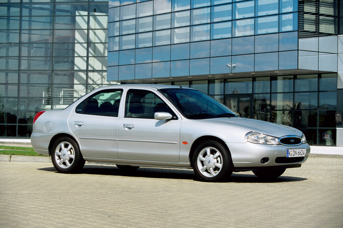 This archival image documents the 1996 Ford Mondeo Mark II in front of glass building and is preserved in the Ford Heritage Vault as part of Ford Motor Company's historic photographic archive. Free for personal, non-commercial use. Ford Heritage V...