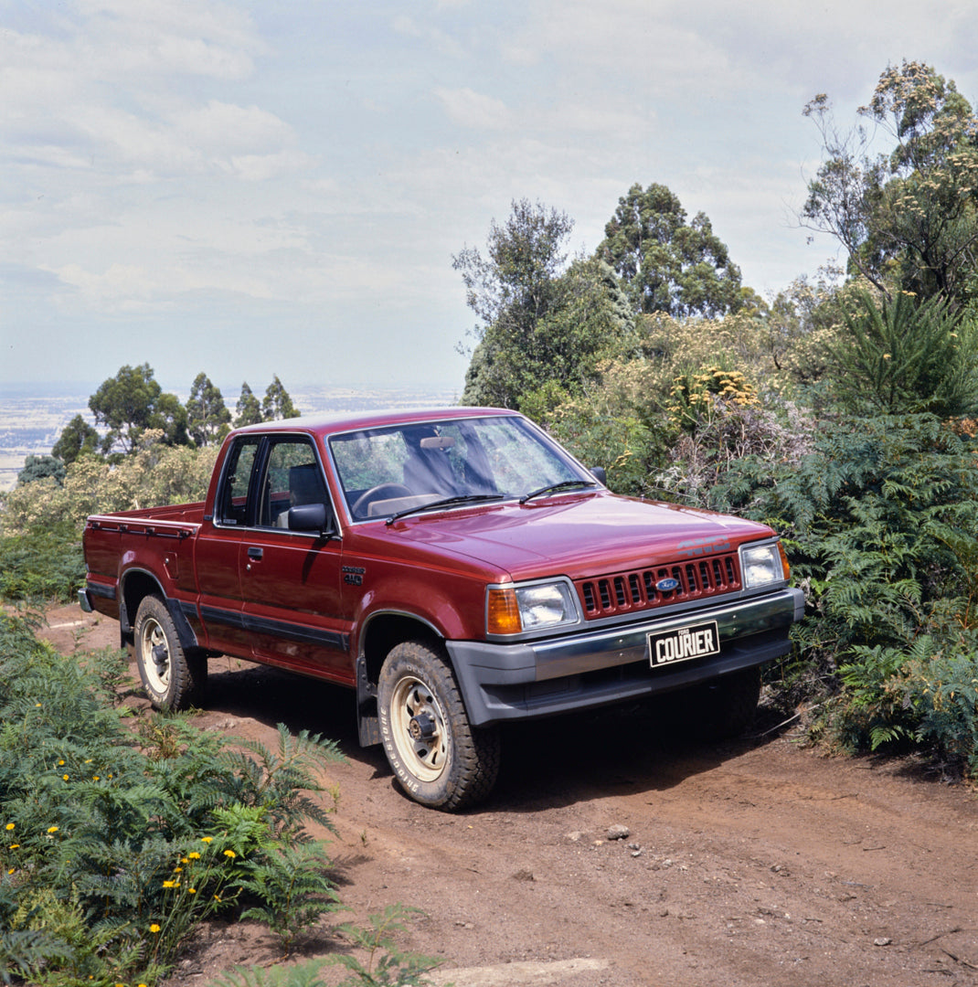This archival image documents the 1984 Ford Courier Pickup Truck Driver Side Front End View on Dirt Path FAP-2011-3 and is preserved in the Ford Heritage Vault as part of Ford Motor Company's historic photographic archive. Free for personal, non-c...