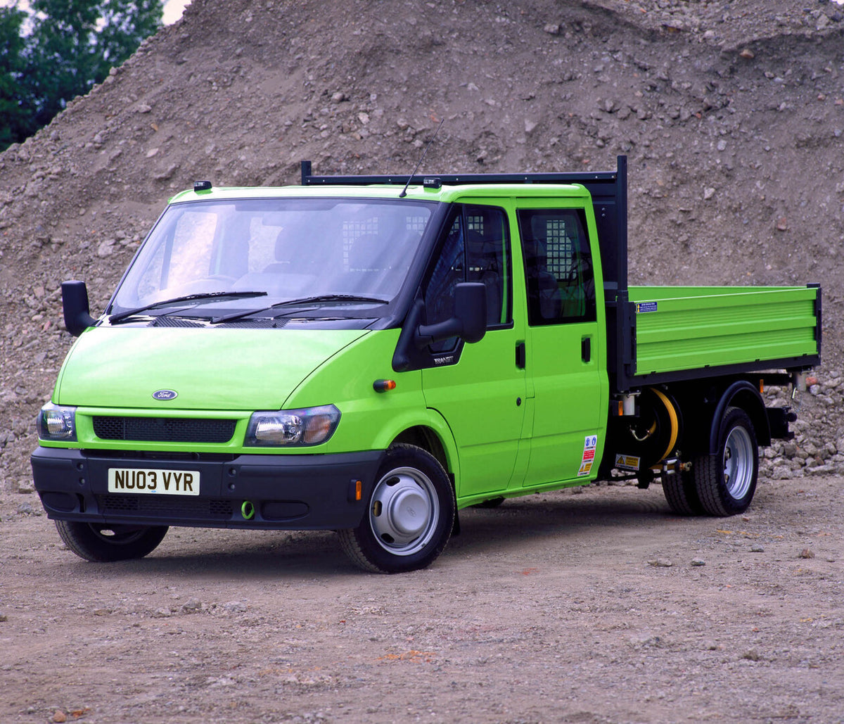 This archival image documents the 2003 Ford Transit Mark IV pickup near dirt pile and is preserved in the Ford Heritage Vault as part of Ford Motor Company's historic photographic archive. Free for personal, non-commercial use. Ford Heritage Vault...