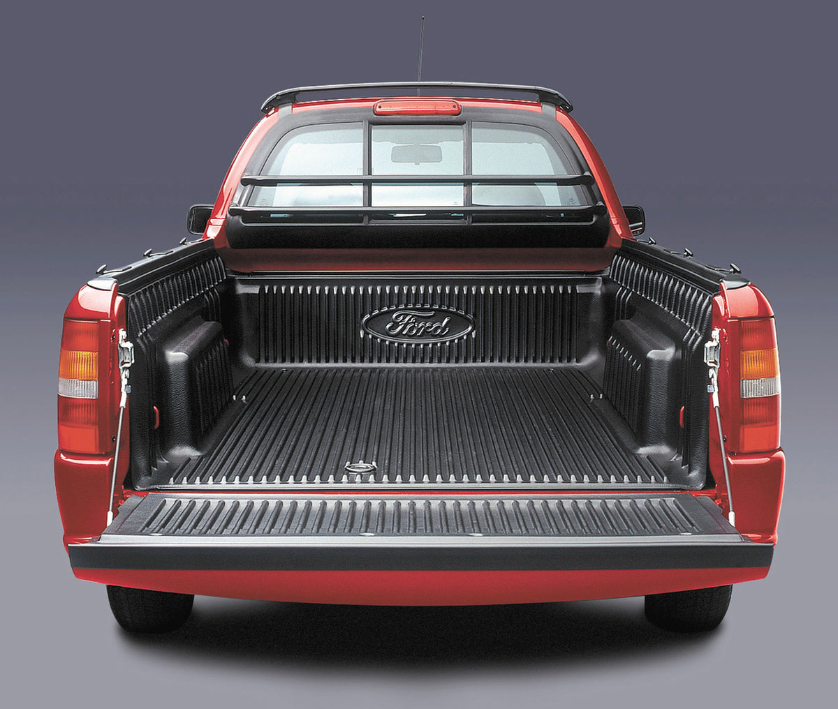 This archival image documents the 2003 Ford Courier rear view with lowered tailgate in studio MS219682 and is preserved in the Ford Heritage Vault as part of Ford Motor Company's historic photographic archive. Free for personal, non-commercial use...
