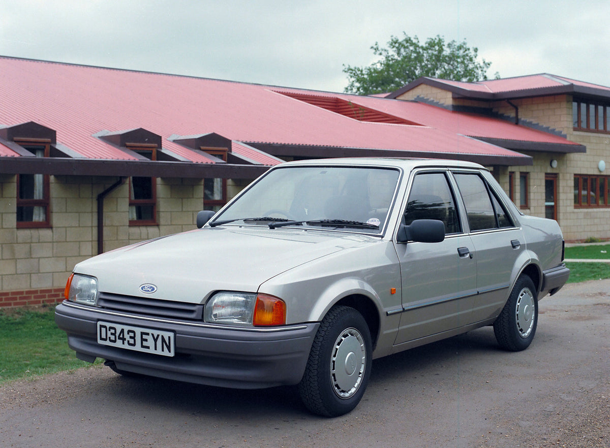 This archival image documents the 1986 Ford Orion GL MKII front 3/4 view in front of building and is preserved in the Ford Heritage Vault as part of Ford Motor Company's historic photographic archive. Free for personal, non-commercial use. Ford He...