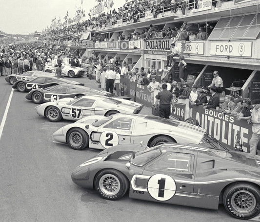 Ford Mk IV No. 1 and No. 2 lead the Ford line-up along the pit lane at the 1967 24 Hours of Le Mans. Archive reference 0001-4708.
