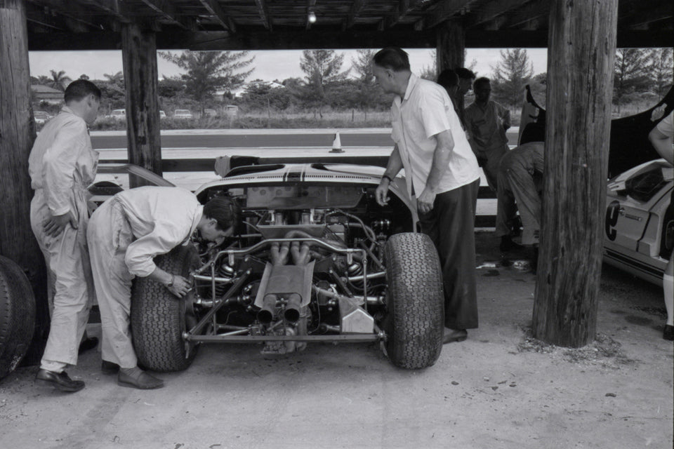 1964 Mechanics working on race car — Nassau — 0064-0048