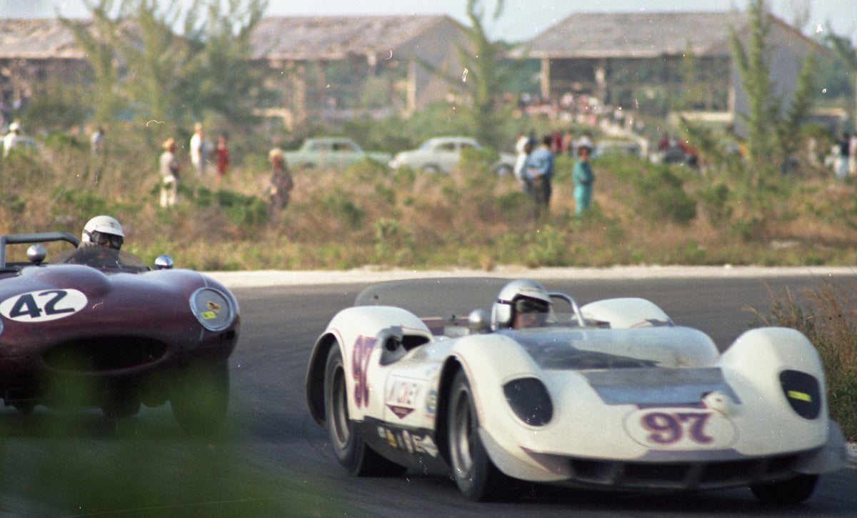 1965 Sports cars racing through a corner — Nassau — 0065-0002