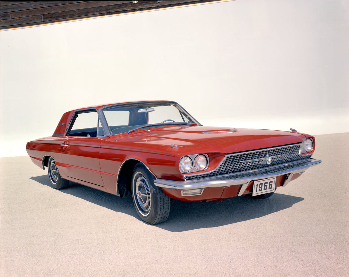 This close front three-quarter photograph shows a 1966 Thunderbird Hardtop against a studio backdrop.