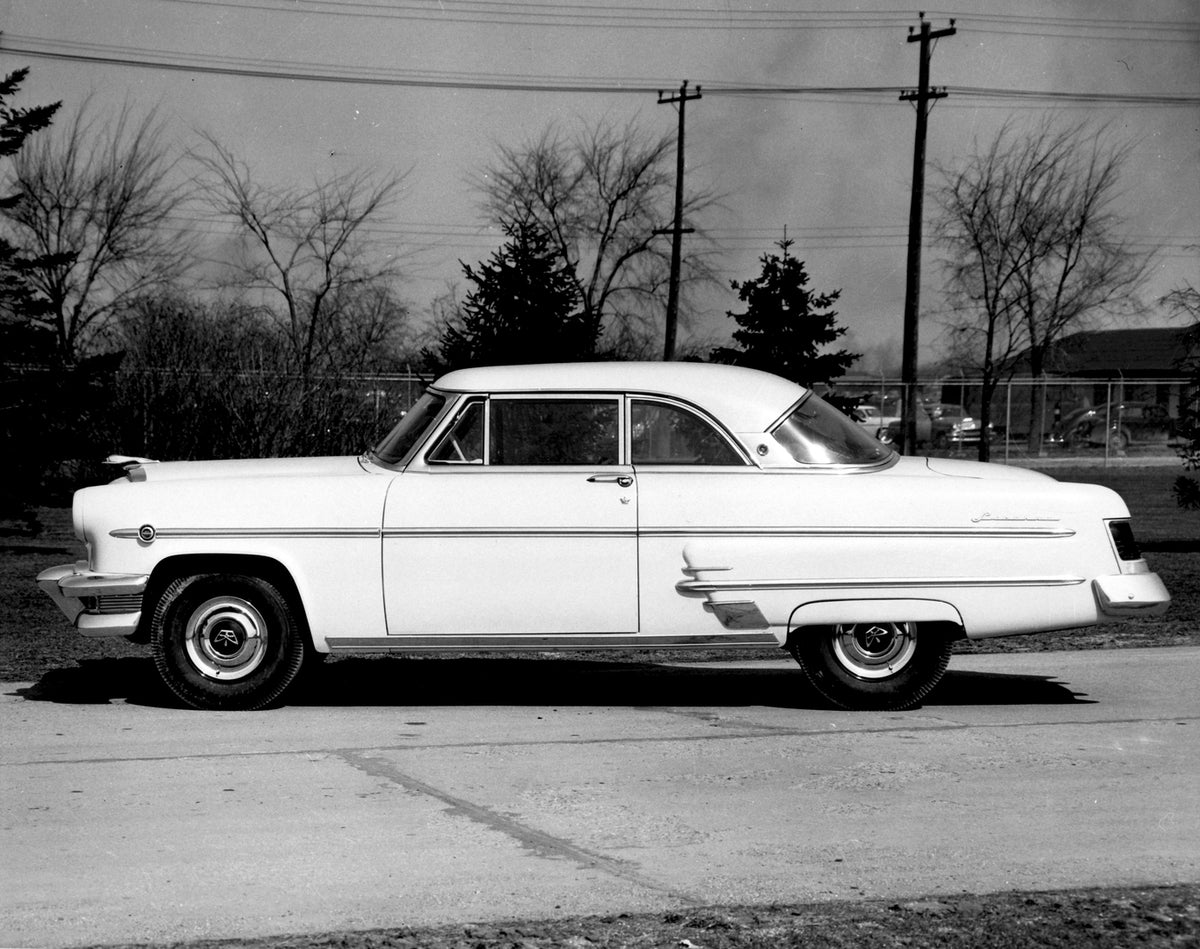 This archival image documents the 1954 Monarch Lucerne Coupe side view on scenic road with trees AR-2007-5 and is preserved in the Ford Heritage Vault as part of Ford Motor Company's historic photographic archive. Free for personal, non-commercial...