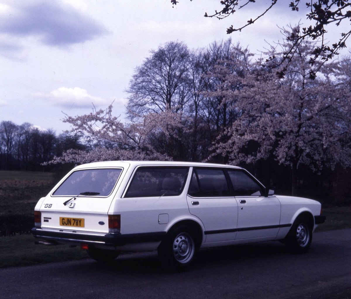 This archival image documents the 1983 Ford Granada Diesel 2.6 Estate rear view on scenic road with trees and is preserved in the Ford Heritage Vault as part of Ford Motor Company's historic photographic archive. Free for personal, non-commercial ...