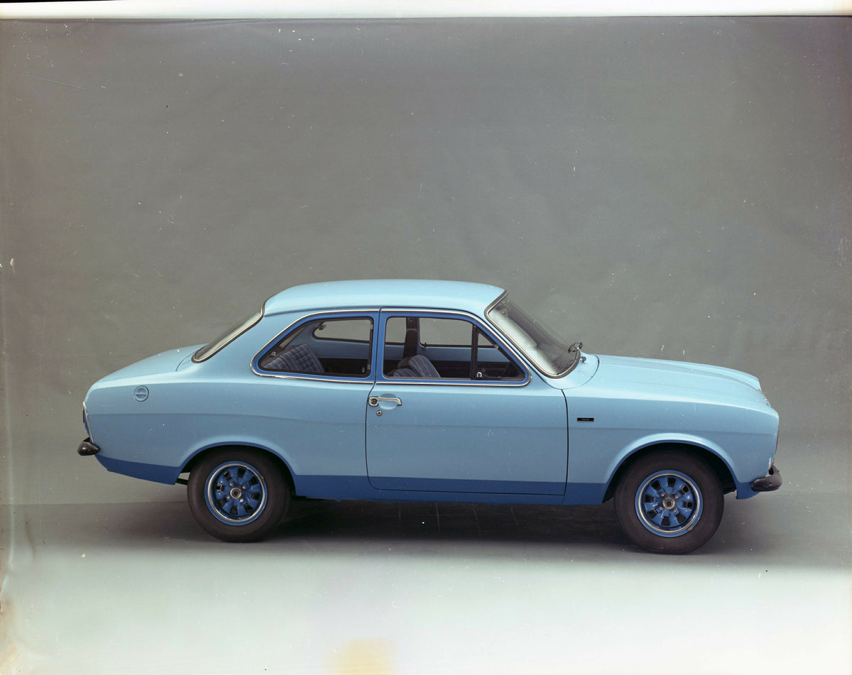 This archival image documents the 1974 Ford Escort Mark I side view in studio and is preserved in the Ford Heritage Vault as part of Ford Motor Company's historic photographic archive. Free for personal, non-commercial use. Ford Heritage Vault ref...