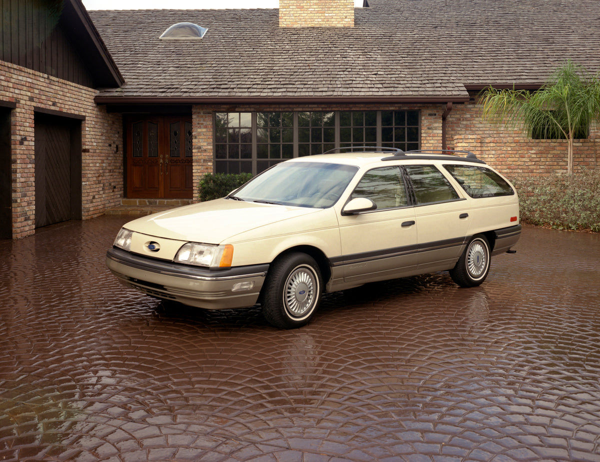 This archival image documents the 1986 Ford Taurus station wagon and is preserved in the Ford Heritage Vault as part of Ford Motor Company's historic photographic archive. Free for personal, non-commercial use. Ford Heritage Vault reference AR-200...