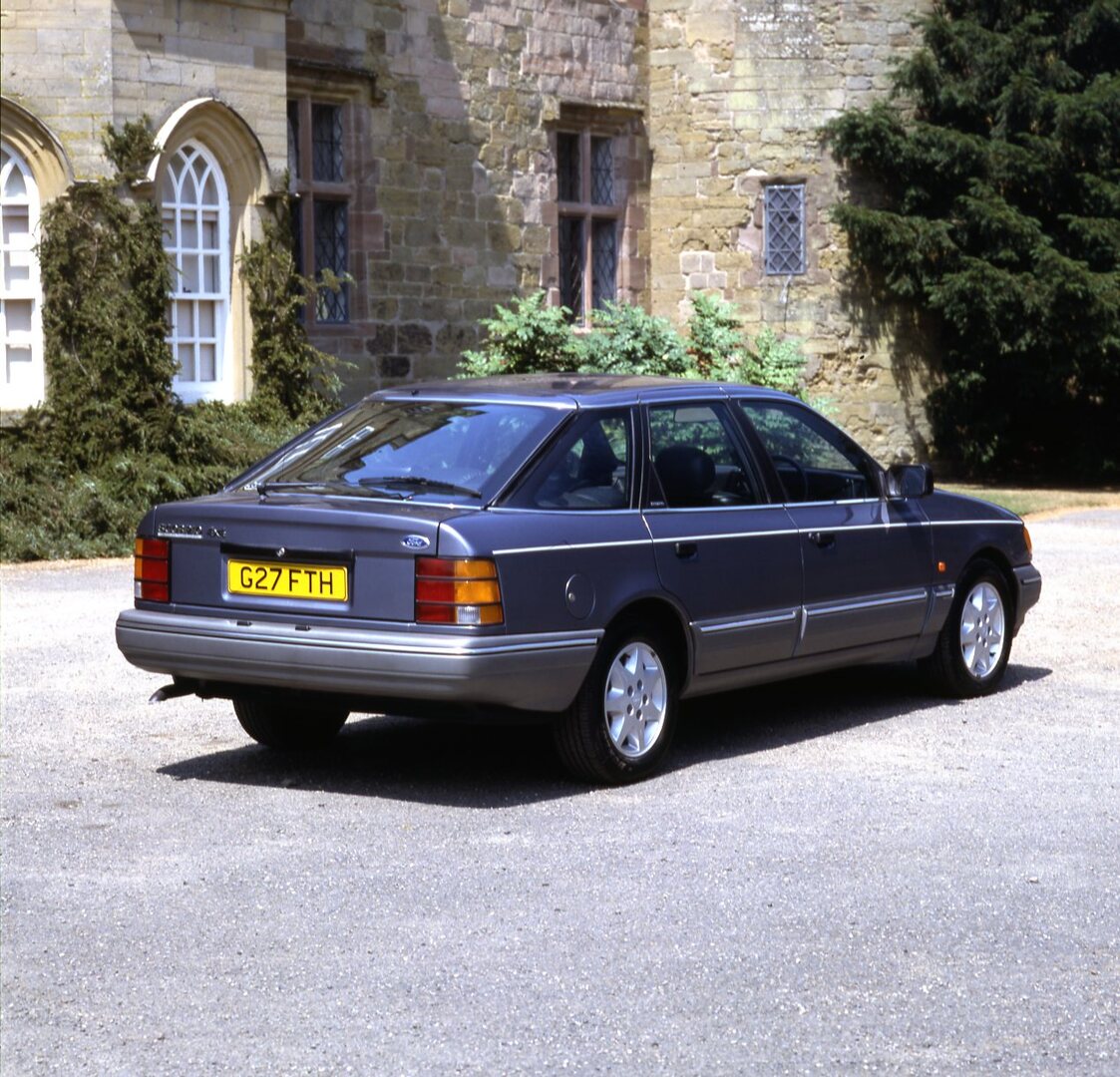 This archival image documents the 1989 Ford Granada Scorpio MK I 4x4 rear view at scenic castle and is preserved in the Ford Heritage Vault as part of Ford Motor Company's historic photographic archive. Free for personal, non-commercial use. Ford ...