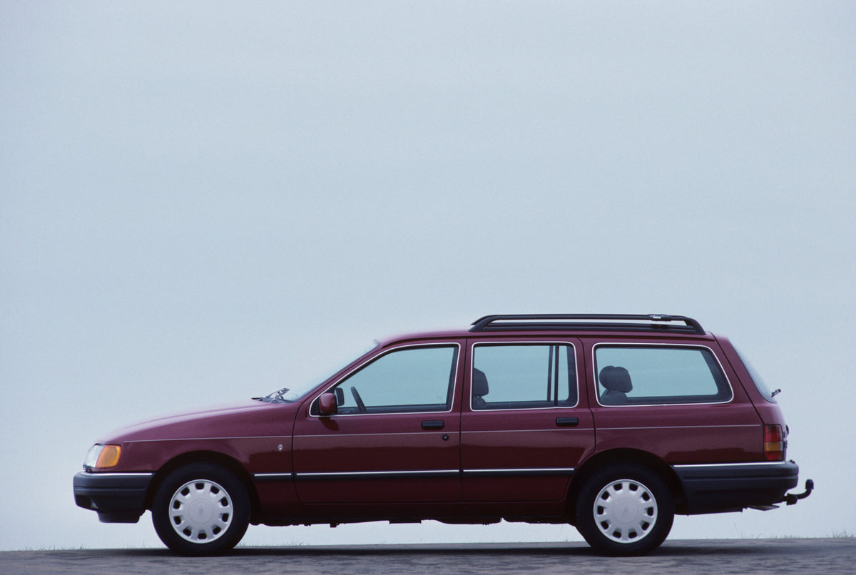 This archival image documents the 1987 Ford Seria 2.0 Ghia side view with scenic blue sky and is preserved in the Ford Heritage Vault as part of Ford Motor Company's historic photographic archive. Free for personal, non-commercial use. Ford Herita...