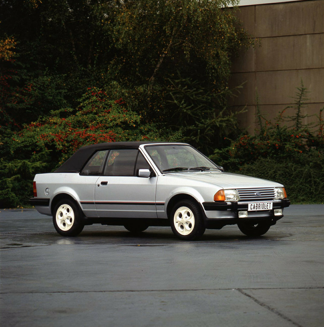 This archival image documents the 1981 Ford Escort XR3 Cabriolet Mark III with plants in background and is preserved in the Ford Heritage Vault as part of Ford Motor Company's historic photographic archive. Free for personal, non-commercial use. F...