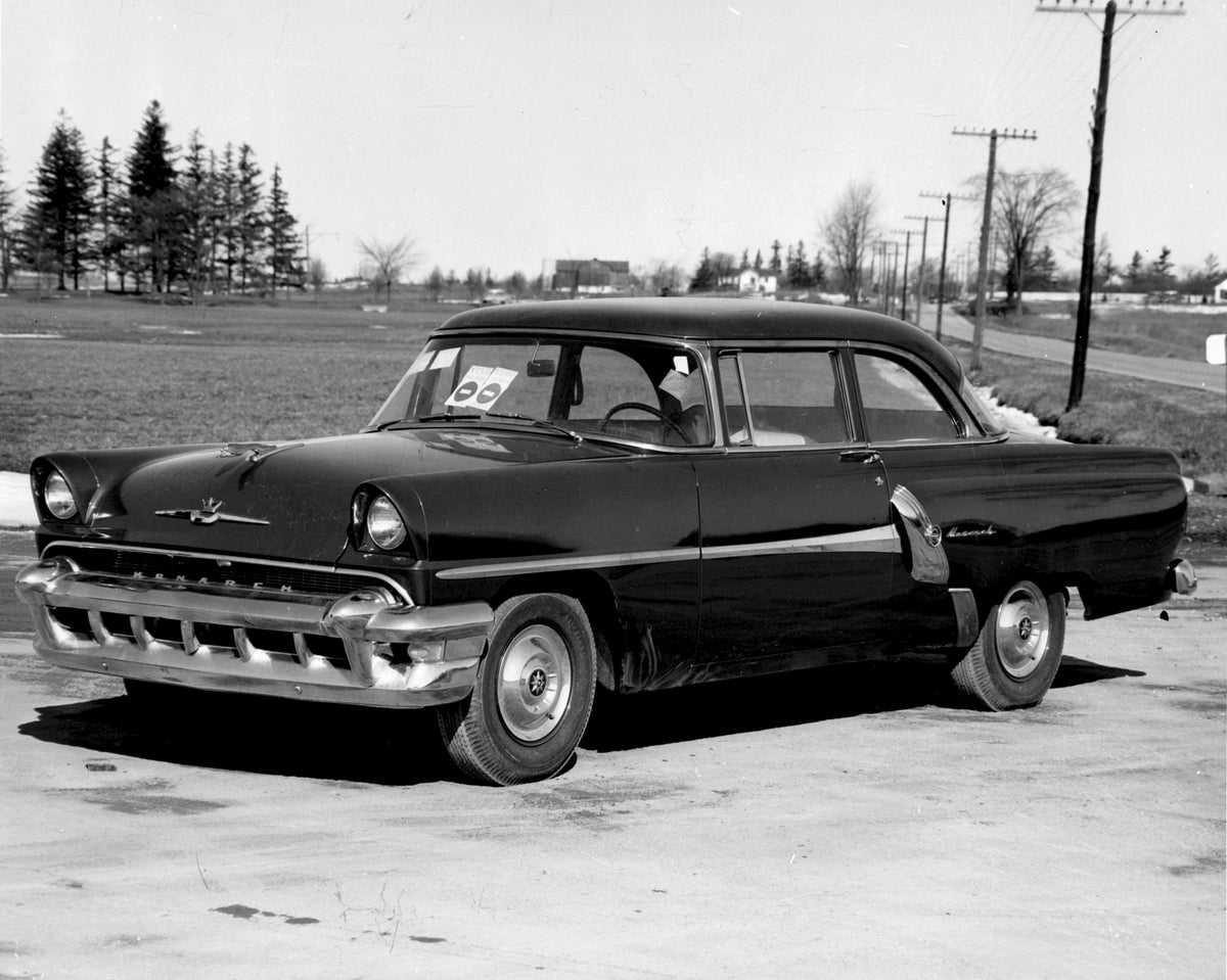 This archival image documents the 1955 Monarch Lucerne Coupe on scenic road AR-2007-5 and is preserved in the Ford Heritage Vault as part of Ford Motor Company's historic photographic archive. Free for personal, non-commercial use. Ford Heritage V...