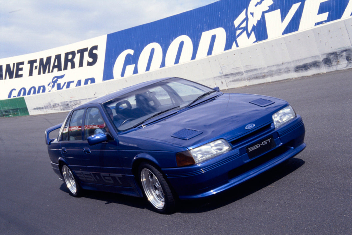 This archival image documents the 1992 Ford EB Falcon GT Driver Side Front End View on Race Track FAP-2011-3 and is preserved in the Ford Heritage Vault as part of Ford Motor Company's historic photographic archive. Free for personal, non-commerci...