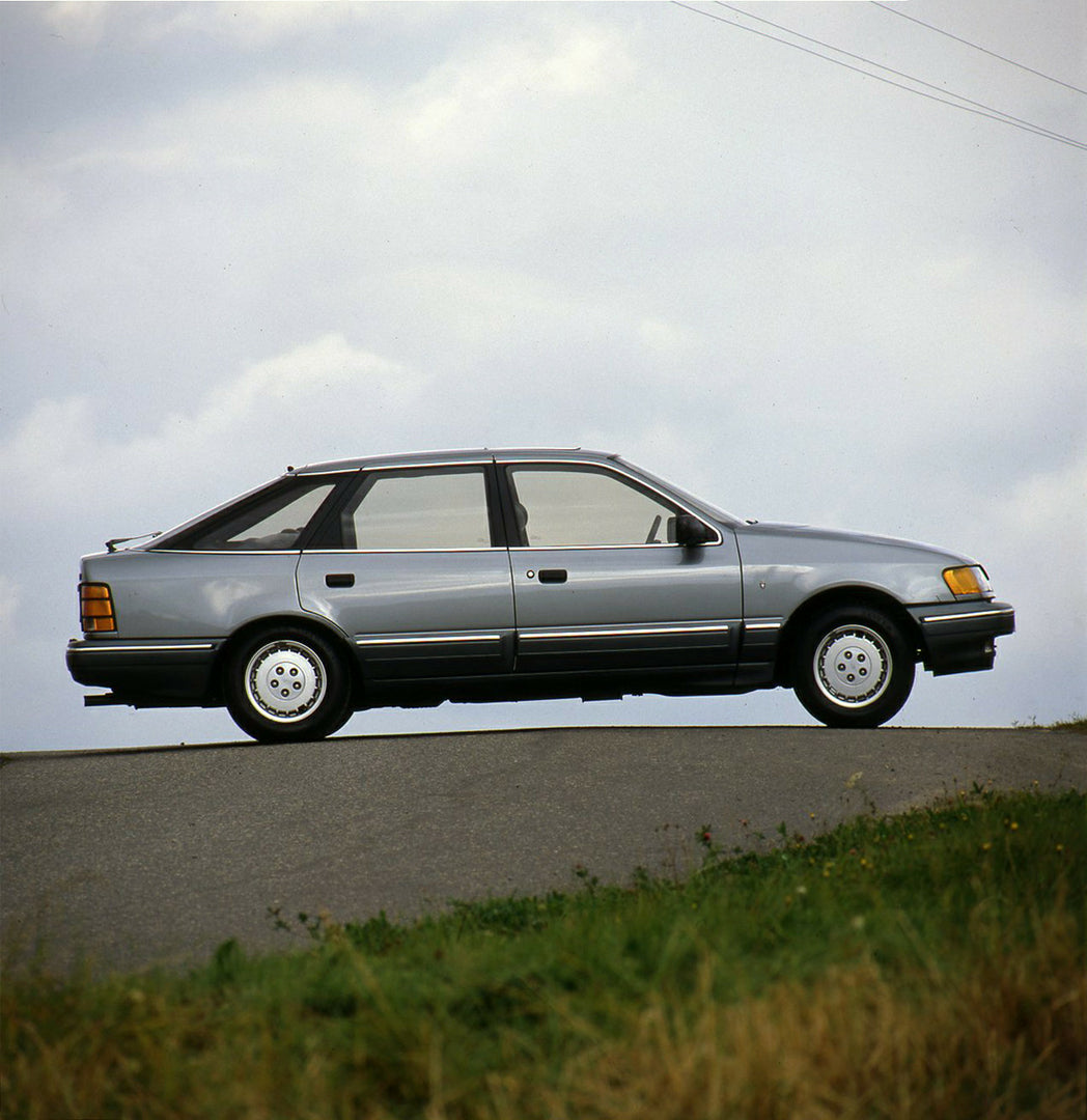 This archival image documents the 1985 Ford Scorpio Mark I Ghia side view on road and is preserved in the Ford Heritage Vault as part of Ford Motor Company's historic photographic archive. Free for personal, non-commercial use. Ford Heritage Vault...
