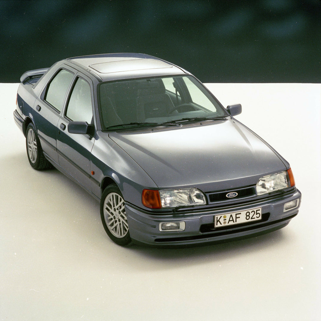 This archival image documents the 1987 Ford Sierra RS Cosworth Sapphire front angled view in Kubiseh Studio and is preserved in the Ford Heritage Vault as part of Ford Motor Company's historic photographic archive. Free for personal, non-commercia...
