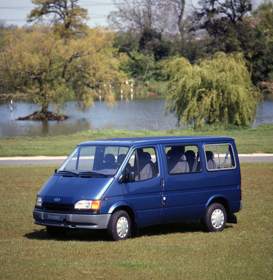 This archival image documents the 1991 Ford Transit Mark III LCX 9 Seater Bus LHD near scenic lake with trees and is preserved in the Ford Heritage Vault as part of Ford Motor Company's historic photographic archive. Free for personal, non-commerc...