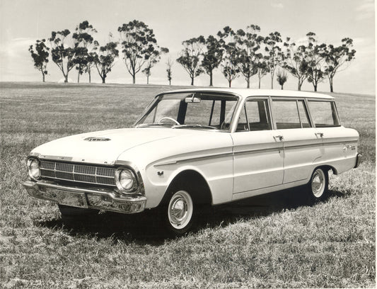 1964 Ford XM Falcon Station Wagon in scenic field with trees HV 1964-0117