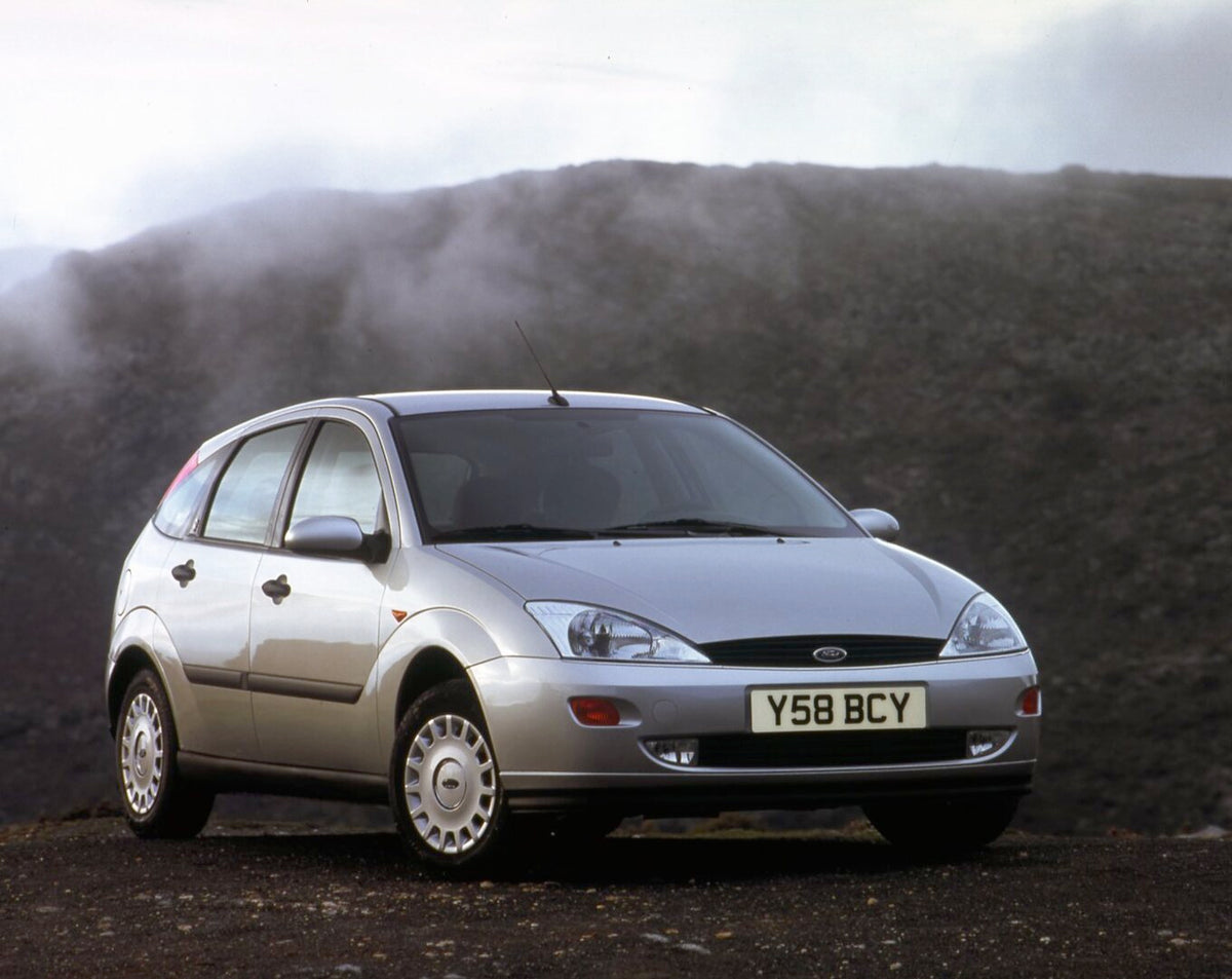 This archival image documents the 2001 Ford Focus Mark I TDCi in mountains with scenic fog and is preserved in the Ford Heritage Vault as part of Ford Motor Company's historic photographic archive. Free for personal, non-commercial use. Ford Herit...