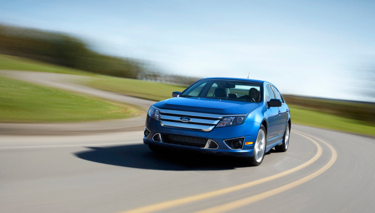 This archival image documents the 2011 Ford Fusion action shot on road MS881421 and is preserved in the Ford Heritage Vault as part of Ford Motor Company's historic photographic archive. Free for personal, non-commercial use. Ford Heritage Vault r...