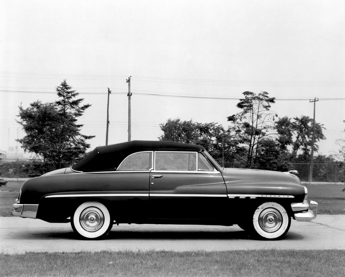 This archival image documents the 1951 Monarch Convertible side view on scenic road with trees AR-2007-5 and is preserved in the Ford Heritage Vault as part of Ford Motor Company's historic photographic archive. Free for personal, non-commercial u...