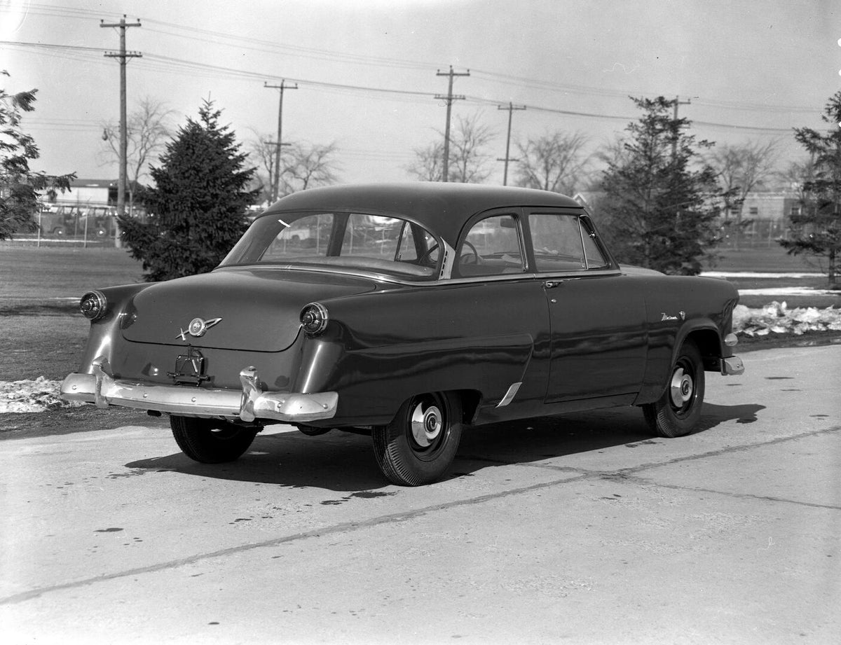 This archival image documents the 1954 Meteor Mainline Coupe rear view on scenic road AR-2007-5 and is preserved in the Ford Heritage Vault as part of Ford Motor Company's historic photographic archive. Free for personal, non-commercial use. Ford ...