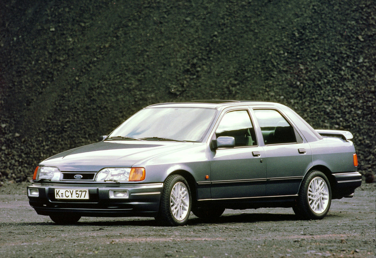 This archival image documents the 1987 Ford Sierra RS Cosworth in gravel pit and is preserved in the Ford Heritage Vault as part of Ford Motor Company's historic photographic archive. Free for personal, non-commercial use. Ford Heritage Vault refe...