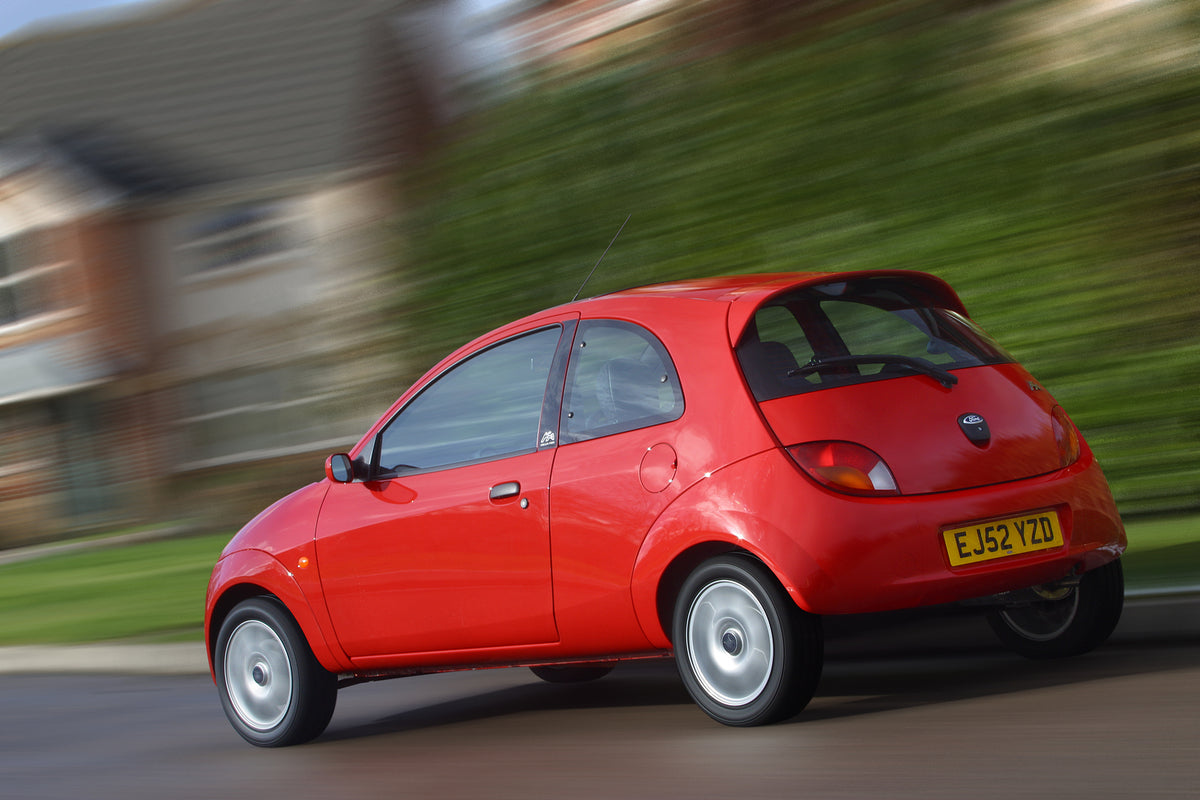 This archival image documents the 2003 Ford Ka Mark I rear view action shot on scenic road and is preserved in the Ford Heritage Vault as part of Ford Motor Company's historic photographic archive. Free for personal, non-commercial use. Ford Herit...