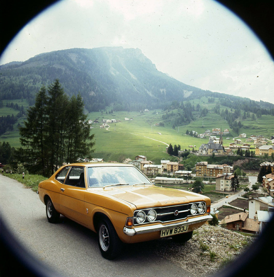 This archival image documents the 1970 Ford Taunus TC fisheye view on scenic road in Italy and is preserved in the Ford Heritage Vault as part of Ford Motor Company's historic photographic archive. Free for personal, non-commercial use. Ford Herit...