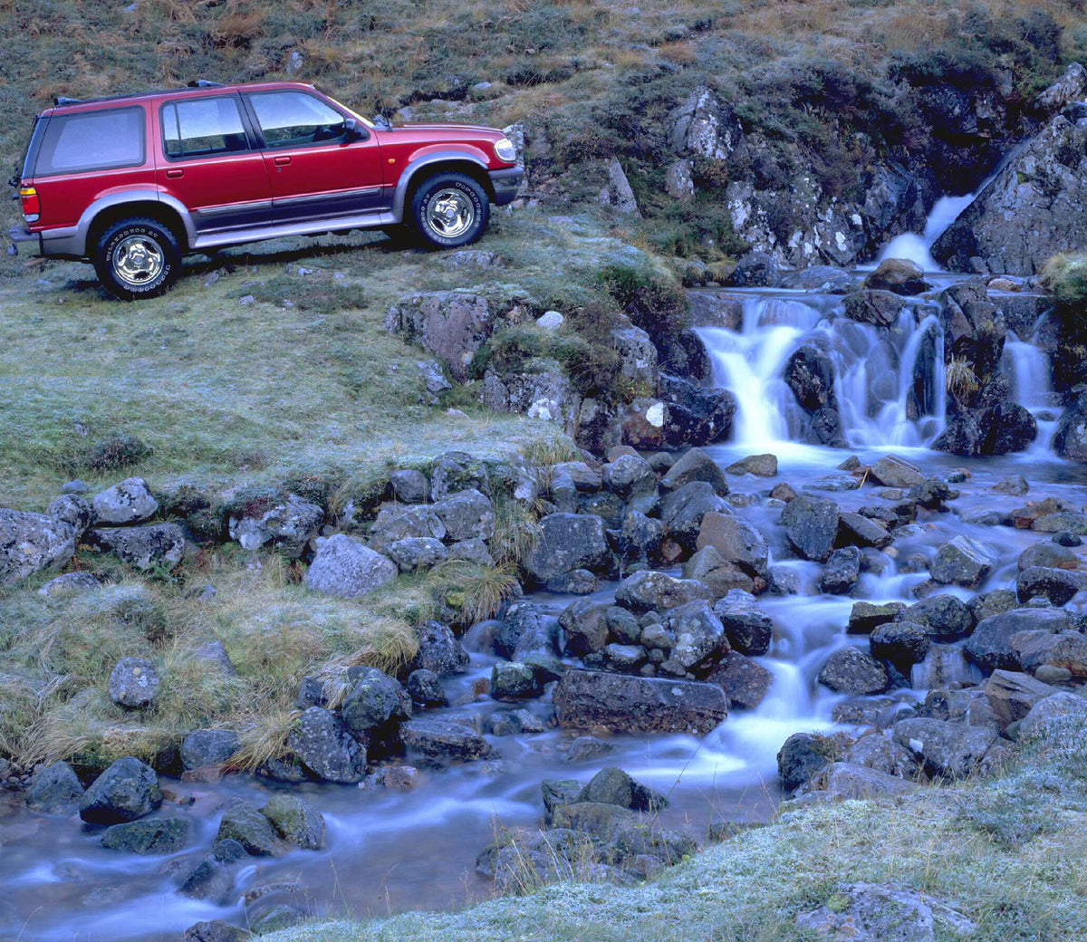 This archival image documents the 1996 Ford Explorer near scenic cascade AR-2002-213709 and is preserved in the Ford Heritage Vault as part of Ford Motor Company's historic photographic archive. Free for personal, non-commercial use. Ford Heritage...