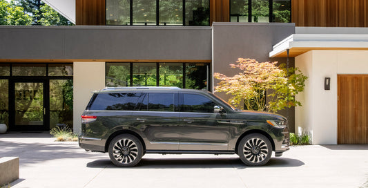 2022 Lincoln Navigator Black Label side view at scenic house HV 2022-0024