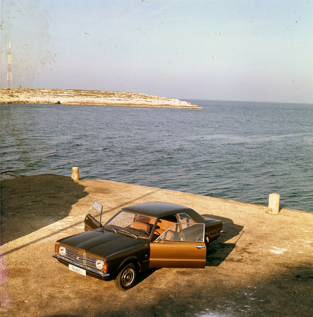 This archival image documents the 1970 Ford Taunus L aerial view with open doors in Italy and is preserved in the Ford Heritage Vault as part of Ford Motor Company's historic photographic archive. Free for personal, non-commercial use. Ford Herita...