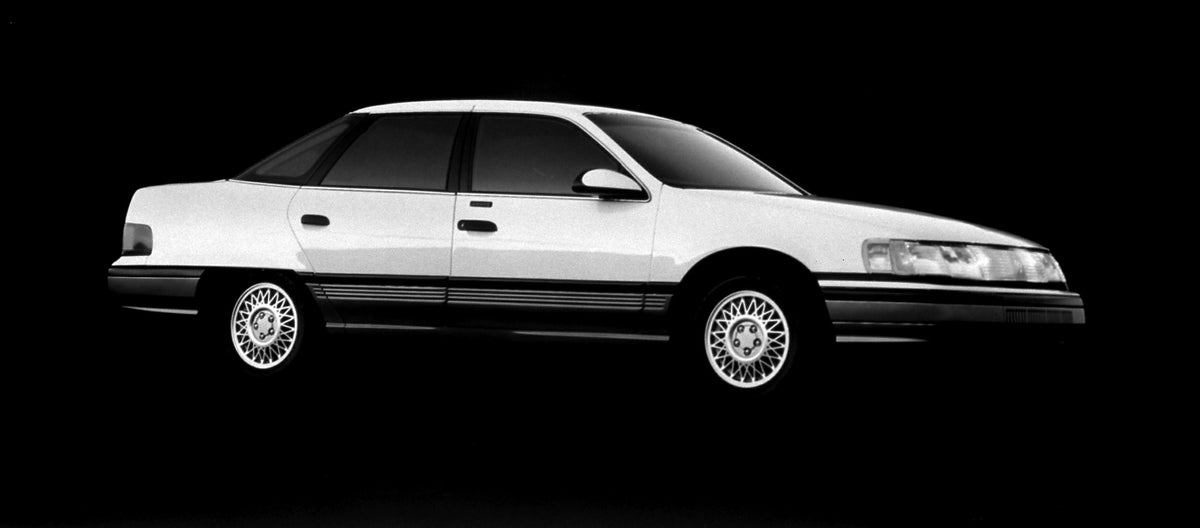 This archival image documents the 1989 Mercury Sable four-door and is preserved in the Ford Heritage Vault as part of Ford Motor Company's historic photographic archive. Free for personal, non-commercial use. Ford Heritage Vault reference AR-2001-...
