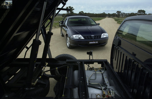 2000 Ford AU Falcon Series II Dedicated LPG Utes on scenic dirt road HV 2000-0074