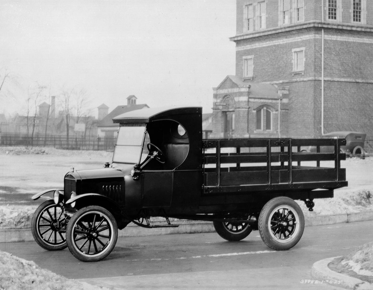 This archival image documents the 1924 Ford Model TT stake bed truck and is preserved in the Ford Heritage Vault as part of Ford Motor Company's historic photographic archive. Free for personal, non-commercial use. Ford Heritage Vault reference AR...