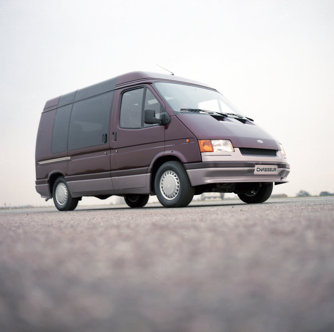 This archival image documents the 1985 Ford Transit Mark III Triton Chasseur on scenic road and is preserved in the Ford Heritage Vault as part of Ford Motor Company's historic photographic archive. Free for personal, non-commercial use. Ford Heri...