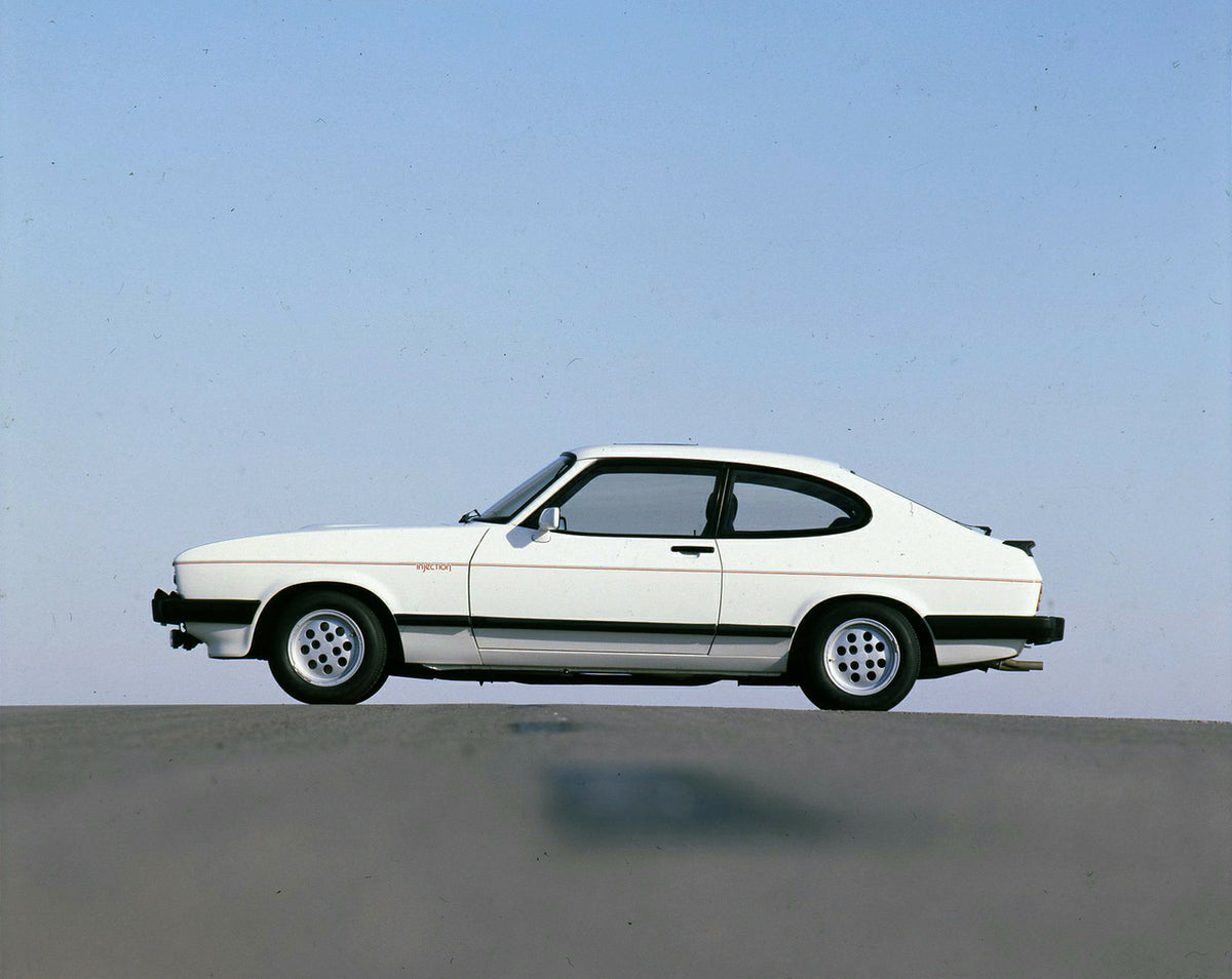 This archival image documents the 1981 Ford Capri Mark III LHD 2.8 Injection side view on road and is preserved in the Ford Heritage Vault as part of Ford Motor Company's historic photographic archive. Free for personal, non-commercial use. Ford H...