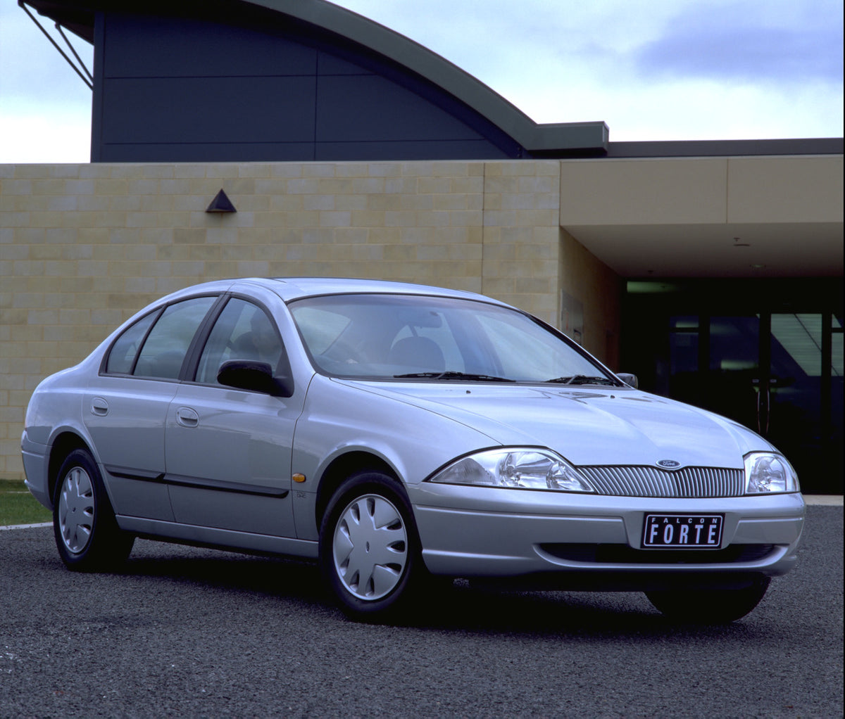 This archival image documents the 1998 Ford Falcon Forte in front of scenic building and is preserved in the Ford Heritage Vault as part of Ford Motor Company's historic photographic archive. Free for personal, non-commercial use. Ford Heritage Va...