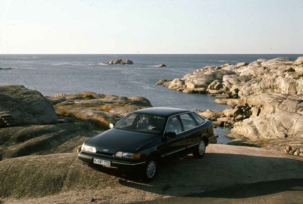 This archival image documents the 1985 Ford Scorpio Mark I GL on scenic rocky beach and is preserved in the Ford Heritage Vault as part of Ford Motor Company's historic photographic archive. Free for personal, non-commercial use. Ford Heritage Vau...